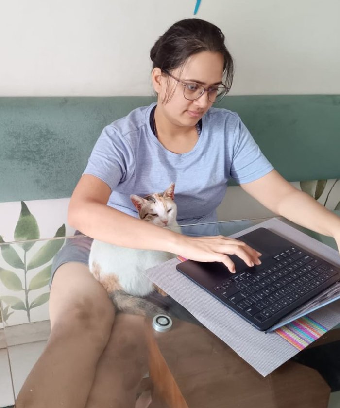Vedika working on her laptop